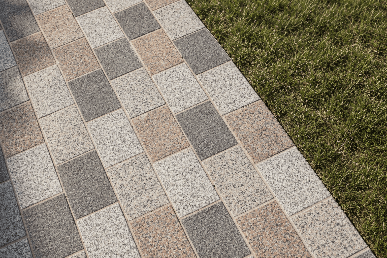 Stone pavers meeting a grass verge